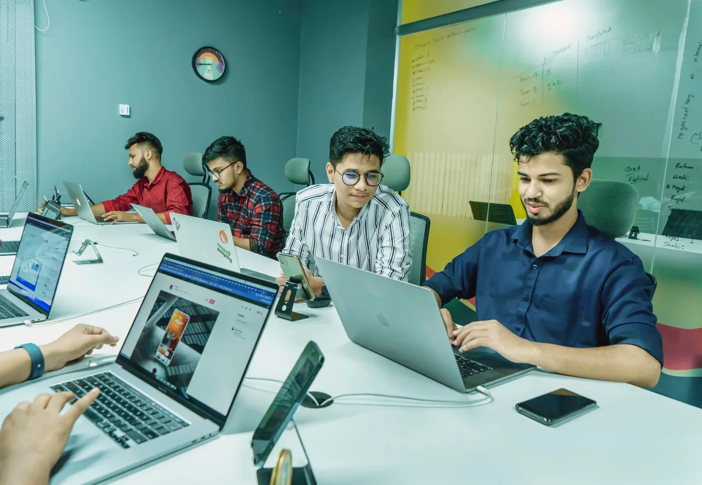 A team working together at a shared desk